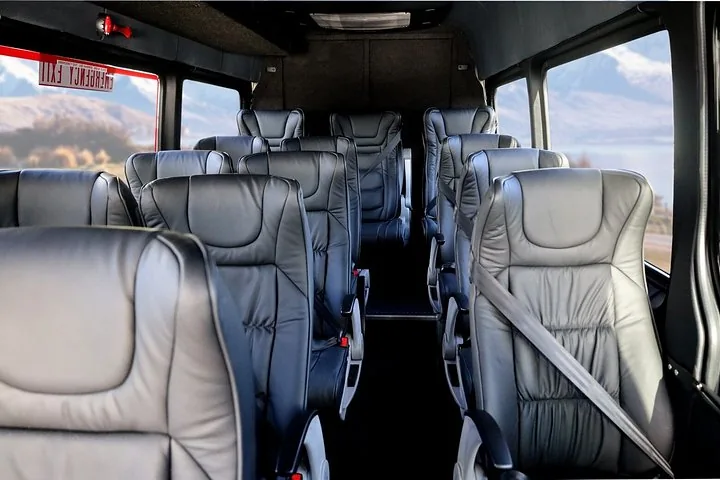 Interior view of comfortable leather seats inside a tour van